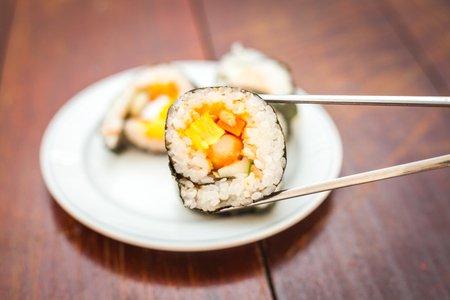 Close up of Rolled sushi rice on a white dishの写真素材