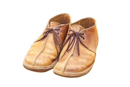 Old brown leather shoes isolate on a white background.の写真素材
