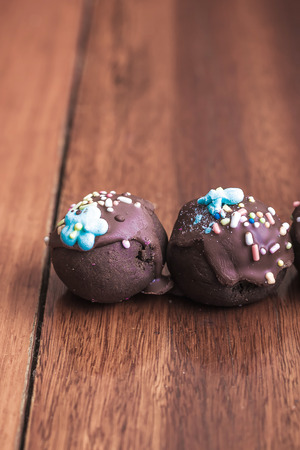 Chocolate balls topping with a sugar resin. Vintage color tone.の写真素材