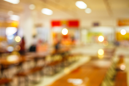 blur image of cafeteria in the University and sun light