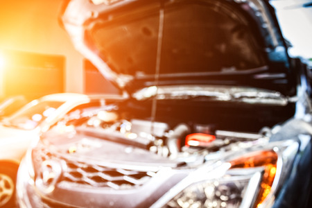 Blur image of checking car engine and Auto Repair and light