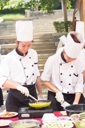 CHIANG-RAI THAILAND-MAY 15: Cooking Competition Students of the School of Tourism Management (Junior Iron Chef) on May 15, 2015 Mae Fah Luang University, Chiang-rai Thailand.のeditorial素材