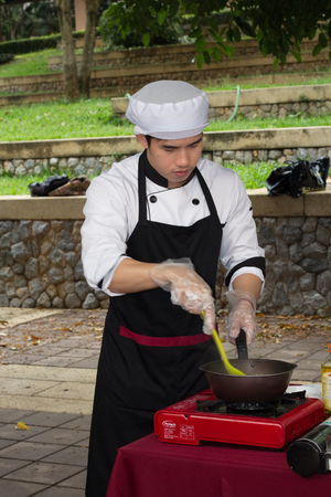 CHIANG-RAI THAILAND-MAY 15: Cooking Competition Students of the School of Tourism Management (Junior Iron Chef) on May 15, 2015 Mae Fah Luang University, Chiang-rai Thailand.のeditorial素材