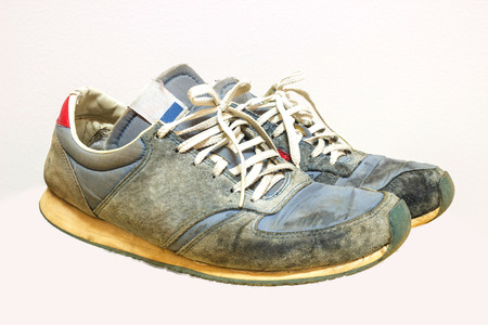 Old running shoes isolate on a white backgroundの写真素材