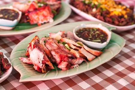 Grilled pork neck with dipping sauce in a northern Thai restaurant.の写真素材