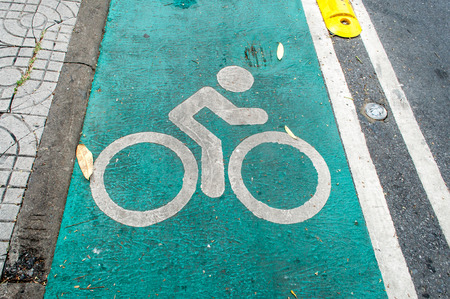 Bike lane sign painted on a streetの写真素材