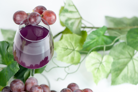 glass with grapes juiceの写真素材