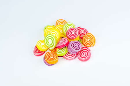 colorful confectionery isolated on white backgroundの写真素材