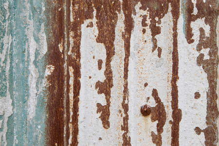 Macro photo of textures in metal, rust and paint, suitable for backgrounds and layersの写真素材