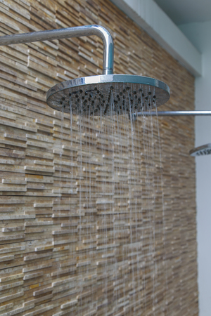 Head shower while running water.の写真素材