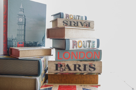 A stack of old books on the table.の写真素材