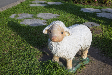 sheep statues decorate in a gardenの写真素材