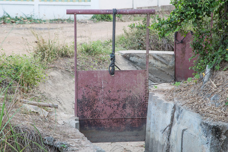Old metal water gate for agriculture.の写真素材