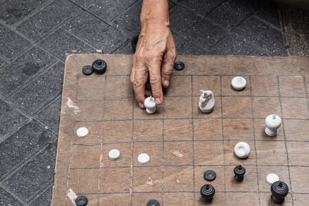 Playing chess at the sunny afternoon.の写真素材