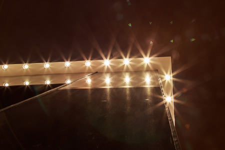 Ceiling downlight on white ceiling, warm light