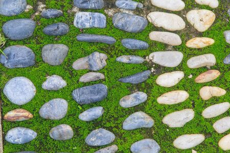Pebble stone wall backgroundの写真素材