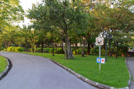 Signs in pubilc park it have no smoke, no walik in area no prohibited to trash no fishing.の写真素材