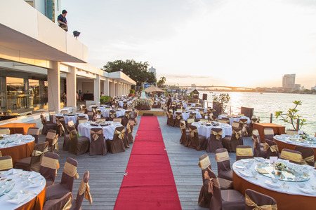 gorgeous wedding chair and table setting for fine dining at outdoorsのeditorial素材