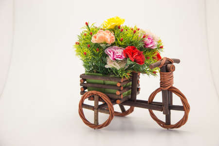 wedding arrangement. fake flower bouquet on bike