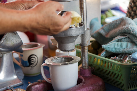 Old metal fruit vegetable juice press squeeze machineの写真素材