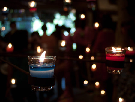 Multicolored candles in clear glass の写真素材