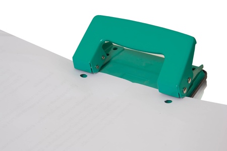 Green hold puncher and paperの写真素材