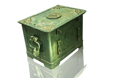 The old antique iron safe isolated on whiteの写真素材