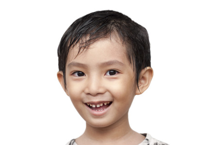 Asian boy smiling on isolate の写真素材
