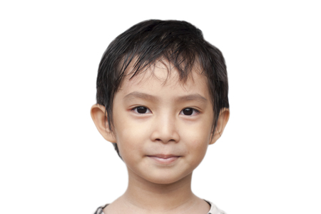 Asian boy smiling close up of face の写真素材