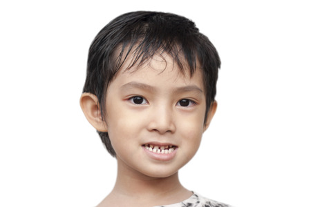Asian boy smiling on isolate の写真素材