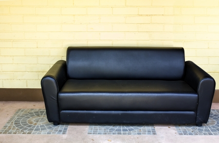 Sofa with yellow wallの写真素材