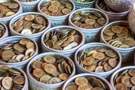 Coins in Silver bowl.の写真素材