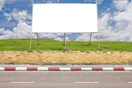 Side road and big white board on grassfield with business man の写真素材