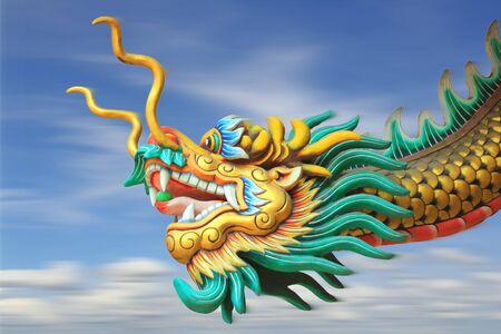 conceptual art : motion blur effect of china dragon statue fast forward movement in the skyの写真素材