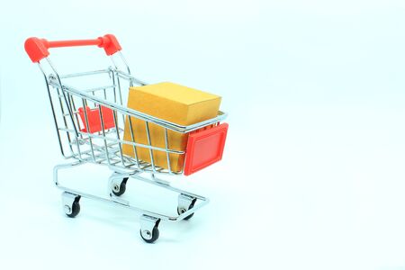single shopping cart with brown box for use with cargo or supermarket and General Factoryの写真素材