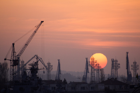 Industrial port dockyard with sunsetの写真素材