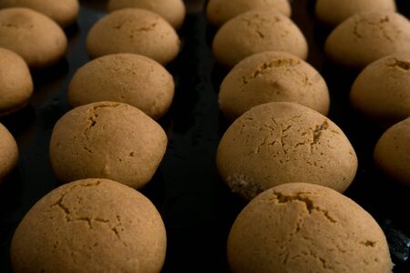 Homemade honey cookies on a black background. Food pattern conceptの写真素材