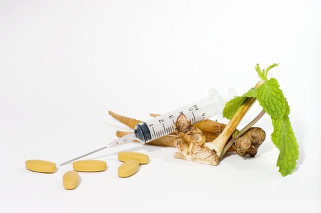 Traditional medicine against homeopathy, isoleted on white background の写真素材