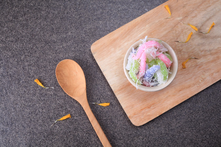 Thai dessert "Khanom Duang" (Sticky Morsels) - Tapioca and rice flour with coconut milk and sugar made into little food colored morsels and sprinkled with shredded coconutの写真素材