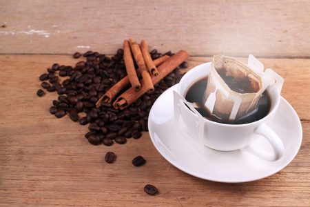 fresh Drip steam coffee bean on wooden tableの写真素材