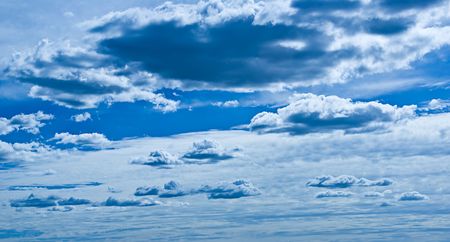 Background image made up of blue sky with clouds.
