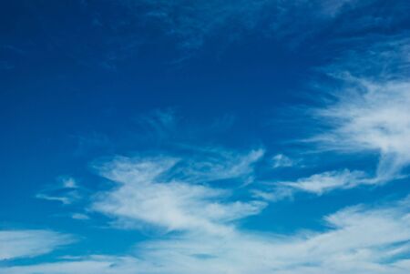Background image made up of blue sky with clouds.