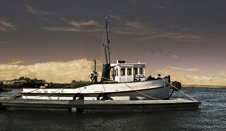 An old wooden fishing trawler ready to go to sea.