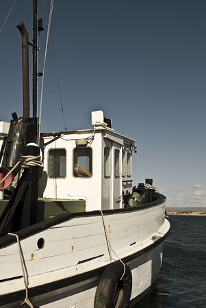 An old wooden fishing trawler ready to go to sea.