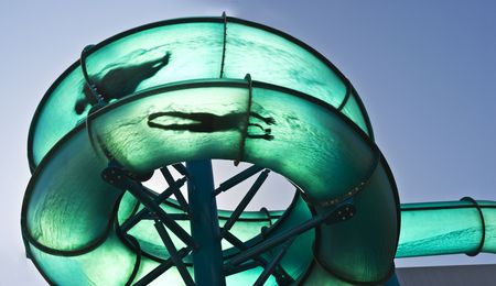 2 people sliding through a water slideの写真素材