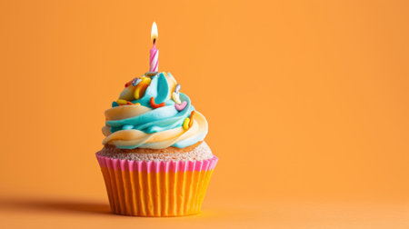 Cheerful studio image of a birthday cupcake featuring a playful mix of frosting colors and a single candle generative aiの素材