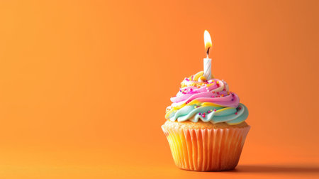 Cheerful studio image of a birthday cupcake featuring a playful mix of frosting colors and a single candle generative aiの素材
