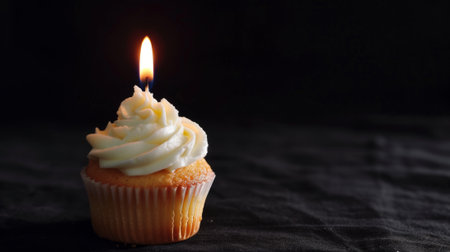 Elegant studio capture of a vanilla cupcake with luscious white frosting and a single candle generative aiの素材
