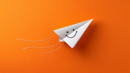 Isolated paper plane with a trail forming a smiling face, bright orange background generative aiの素材