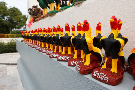 Thai Fighting roosters sculpture on the wall.の写真素材